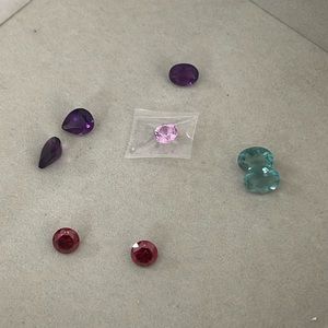 12 ctw of Loose Gemstones: Sapphire, Purple Fluorite, Green Fluorite, Lab Garnet
